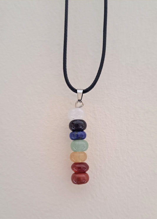 Necklace with seven chakra stones on a black cord.