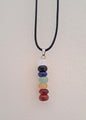 Necklace with seven chakra stones on a black cord.