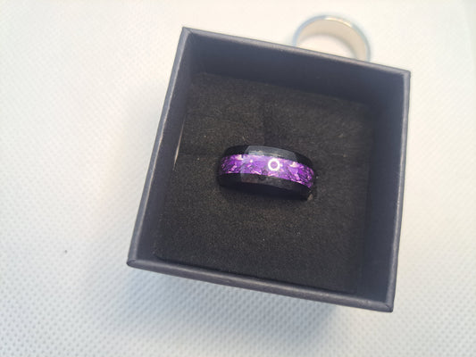 Black ring with purple swirl inlay  design in a black box.